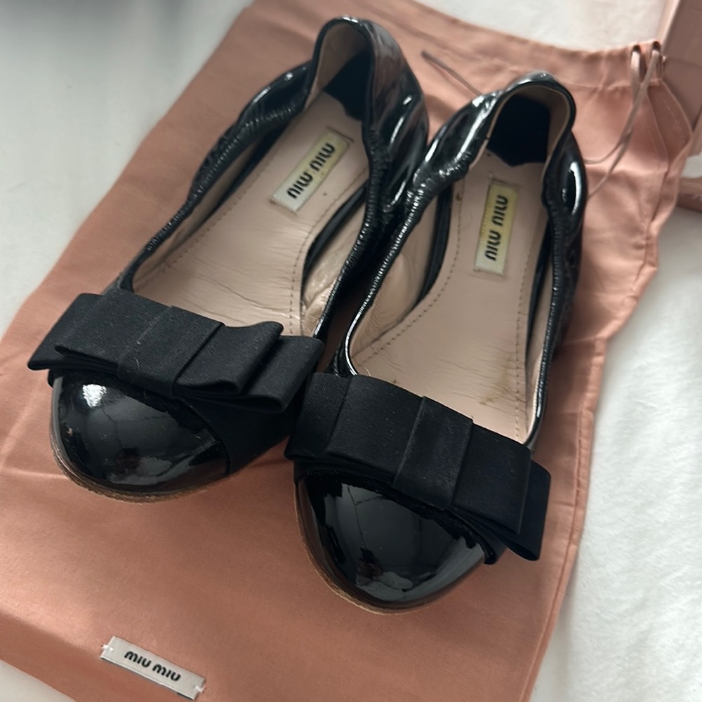 Miu Miu black patent flats with bow detail